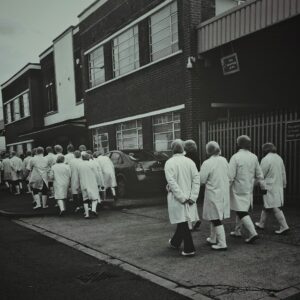 black and white photo of scientists walking