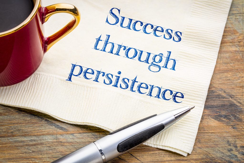 Success through persistence written on a napkin