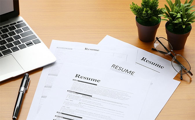 For-Candidates-next-to-text resume and laptop on desk