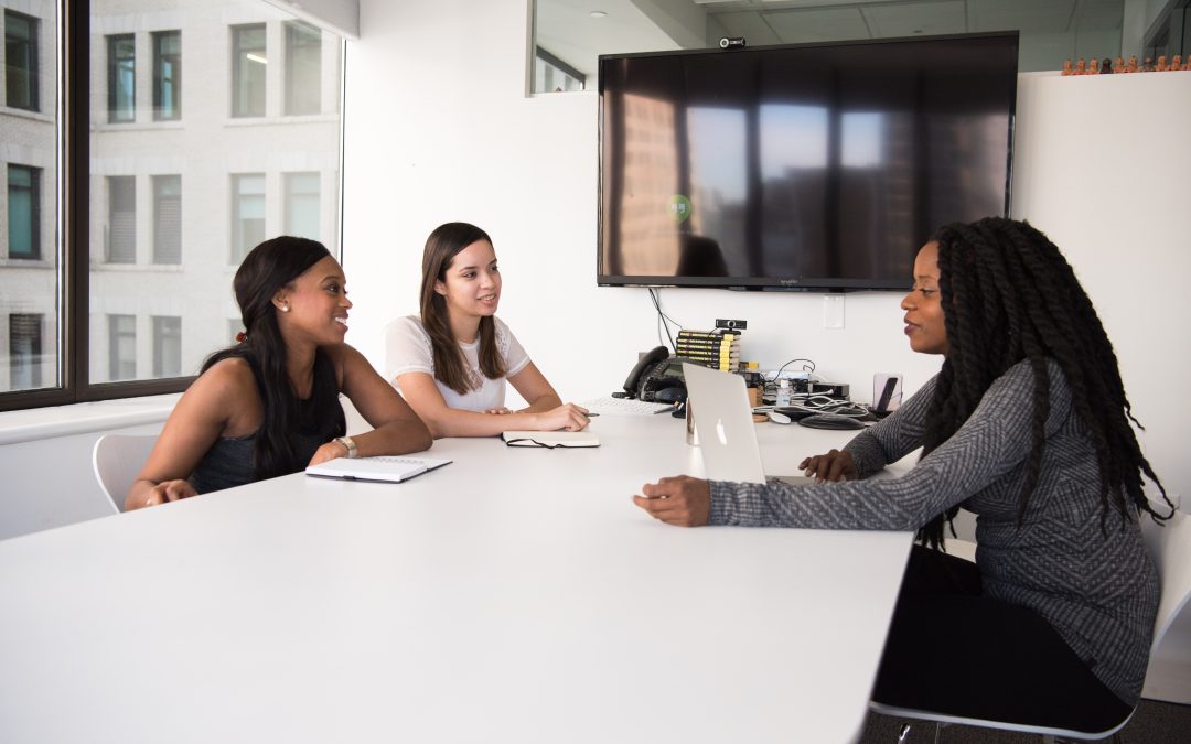 3 women working at desk