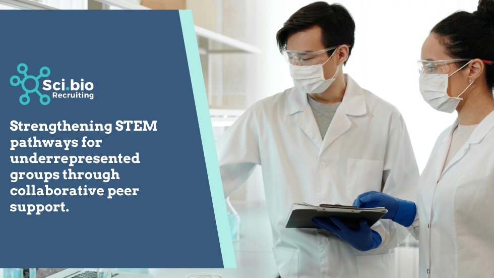 Man in science safety gear reviewing items in a lab