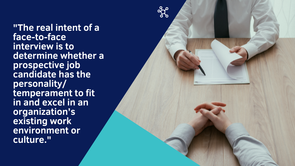 Interviewer pointing to resume across table from interviewee