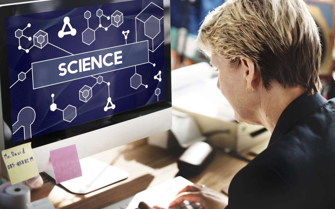 woman sitting at computer with word science in bold