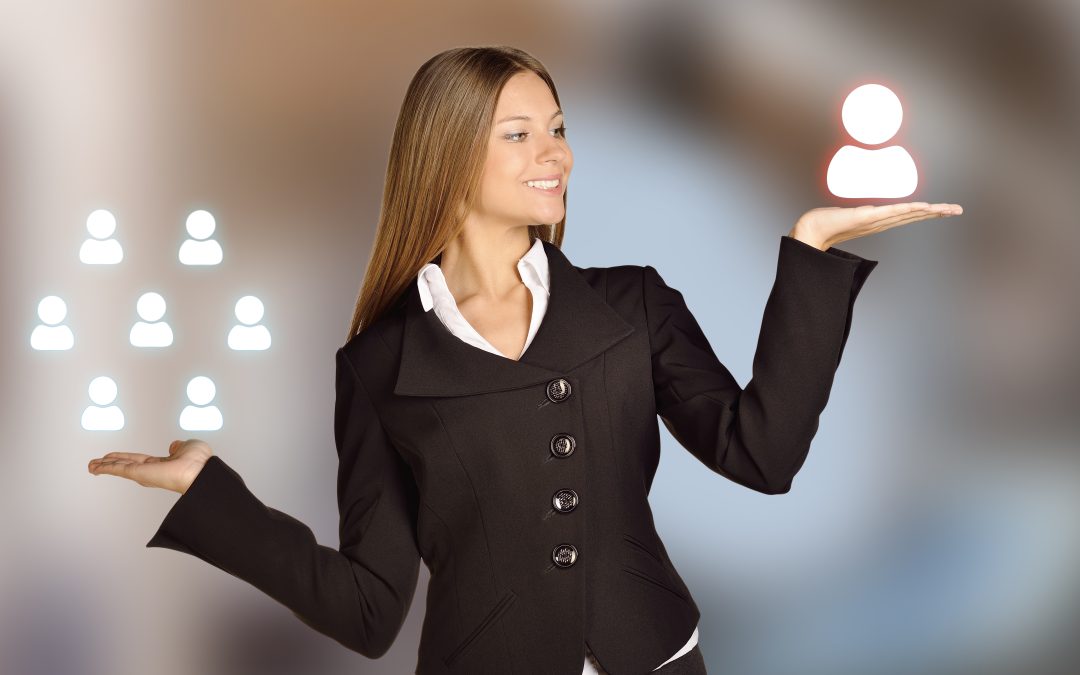 woman in black jacket holding 2 balanced light balls in her hand
